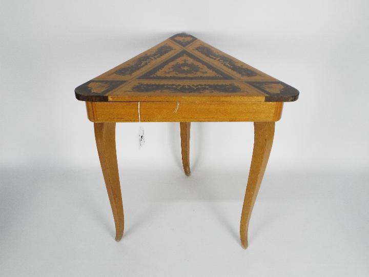 An inlaid musical sewing table with Lador Swiss movement which plays the theme from Love Story when