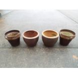 Four garden planters of cylindrical form