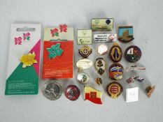 In excess of 20 enamel badges predominan