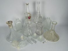 Seven glass decanters.