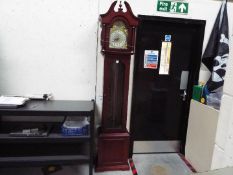 A modern Tempus Fugit longcase clock wit