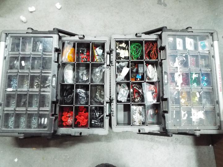 Two accessory organiser boxes, one conta