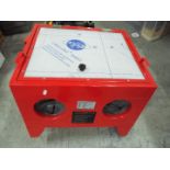 A sand blasting cabinet, approximately 4