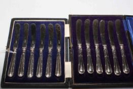 Two cased sets of silver handled tea knives.