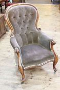 Victorian mahogany framed gents chair in brown button fabric raised on cabriole legs to brass