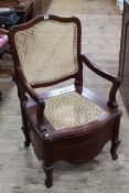 Mahogany framed bergere back and seat commode armchair.