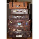 Five vintage suitcases, wicker picnic hamper, pictures and prints.