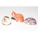 Three Royal Crown Derby paperweights, two Cats with gold stoppers, and Piglet.