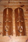 Collection of fourteen carved wood tribal masks.