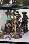 Collection of spelter figures, three branch candle sconce, candlestick and circular plaque.