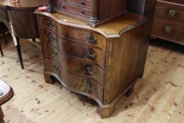 Mahogany serpentine front chest of four graduated oak lined drawers on bracket feet,