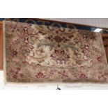 Fawn ground thick pile wool rug, 183cm by 275cm.