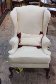 Parker Knoll wing back armchair upholstered in yellow fabric, model PK976.