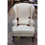 Parker Knoll wing back armchair upholstered in yellow fabric, model PK976.