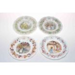 Seven Royal Doulton Brambly Hedge figures together with four seasonal hanging plates and four mugs.