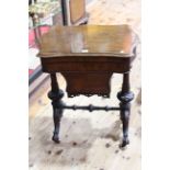 Victorian walnut work table of serpentine form,