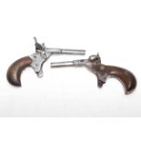 Two antique muff pistols, 11.5cm length. Condition: The one on the left has inscription PAT.6254.13.