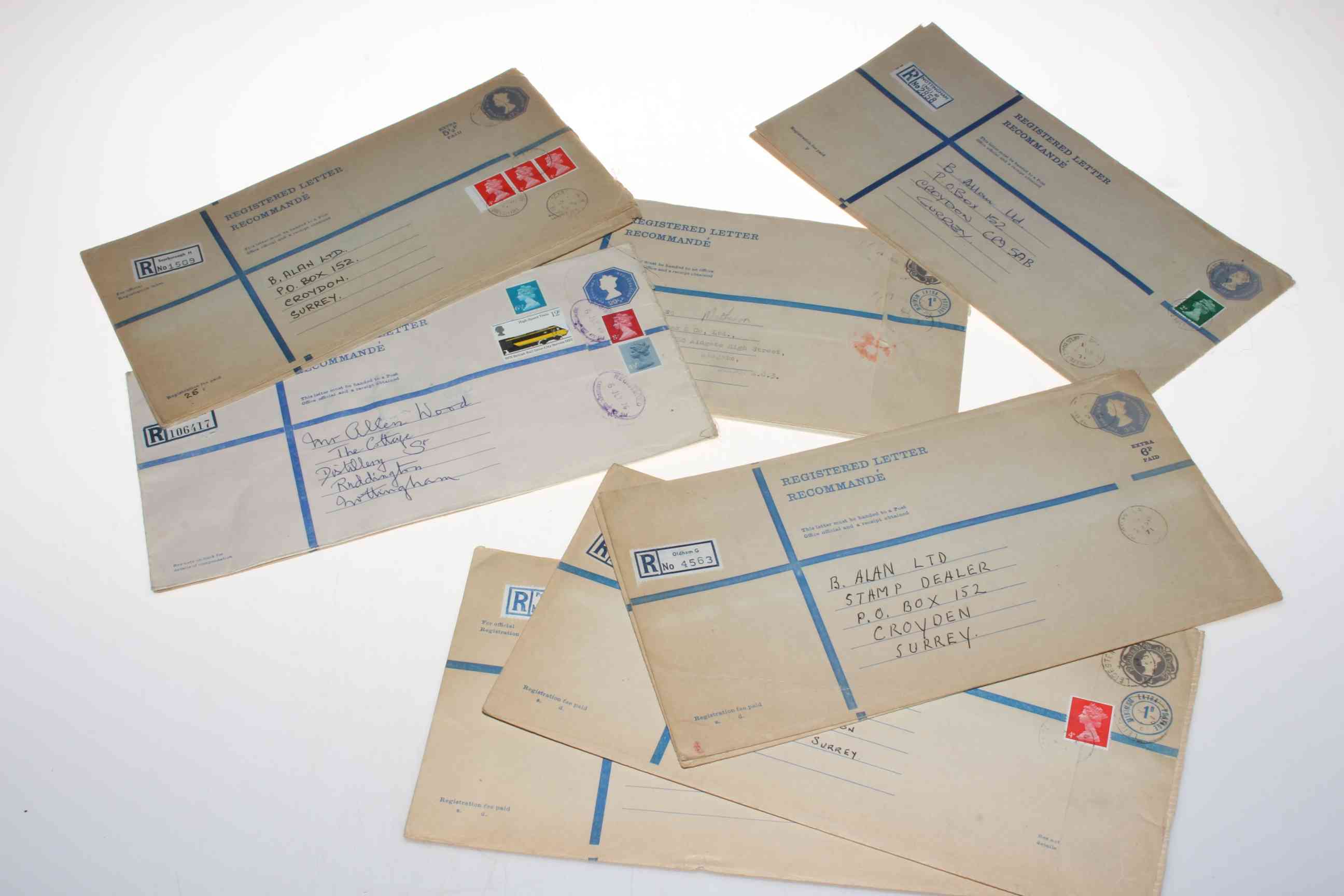 Twelve large letter envelopes with stamps.