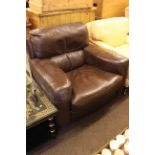 Brown leather armchair.