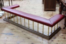 Good quality club fender, the oak base supporting reeded brass supports to studded red leather seat,