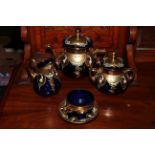 Gilded blue glass eleven piece tea set.