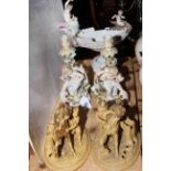Pair Continental cherub candlesticks and maiden boat vase; pair equestrian figures,