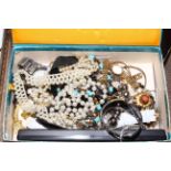 Tray lot with costume jewellery and wristwatches.
