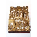 Chinese giltwood carving of immortals and warriors, 33cm by 23cm.