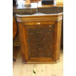 Carved oak corner hanging cupboard. Max width 75cm, depth 33.5cm, height 92.