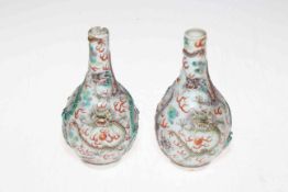 Pair antique Chinese porcelain vases having relief dragon decoration, blue glazed bases, 13cm.