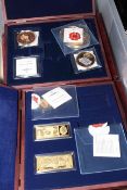 Collection of gold plated bars, medals and nickel coins,
