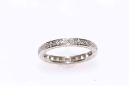 18 carat white gold diamond set eternity ring, size N.