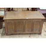 Oak four carved panel fronted blanket box, 104cm by 54cm by 49cm.