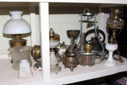 Collection of eight hanging and standing oil lamps including late Victorian brass lamp and ornate