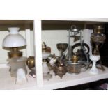 Collection of eight hanging and standing oil lamps including late Victorian brass lamp and ornate