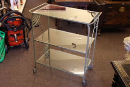 Art Deco painted wrought iron trolley with glass shelves, 70cm wide.