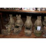 Collection of eighteen garden ornaments, bird baths 64cm, wheel barrow figures 50/55cm.