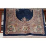Chinese fawn ground floral pattern wool rug.