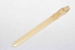 Ivory page turner with Egyptian figure handle, 27cm.