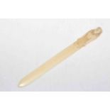 Ivory page turner with Egyptian figure handle, 27cm.