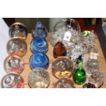 Collection of twenty six paperweights, pressed glass commemorative basket and crystal pieces.