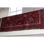 Good quality hand knotted Persian wool carpet, with symmetric pattern on red ground, 2.66 by 2mtrs.