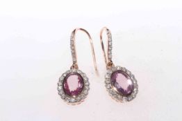 Pair of 14 carat yellow gold, pink sapphire and diamond earrings, 1.48 carat sapphires and 0.