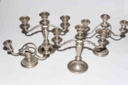 Four silver plated table candelabra.