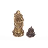 Chinese bronze figure of man with child, 12.5cm, and Fo dog (2).