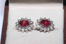 Ruby and diamond ring and pair of ear studs,