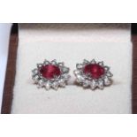 Ruby and diamond ring and pair of ear studs,