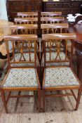 Set of eight inlaid mahogany dining chairs with upholstered and studded seats.