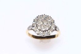 18 carat gold and 21 stone diamond cluster ring, size N.