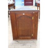 Late Georgian oak arched panel door corner hanging cabinet. Max width 75cm, depth 33.5cm, height 92.